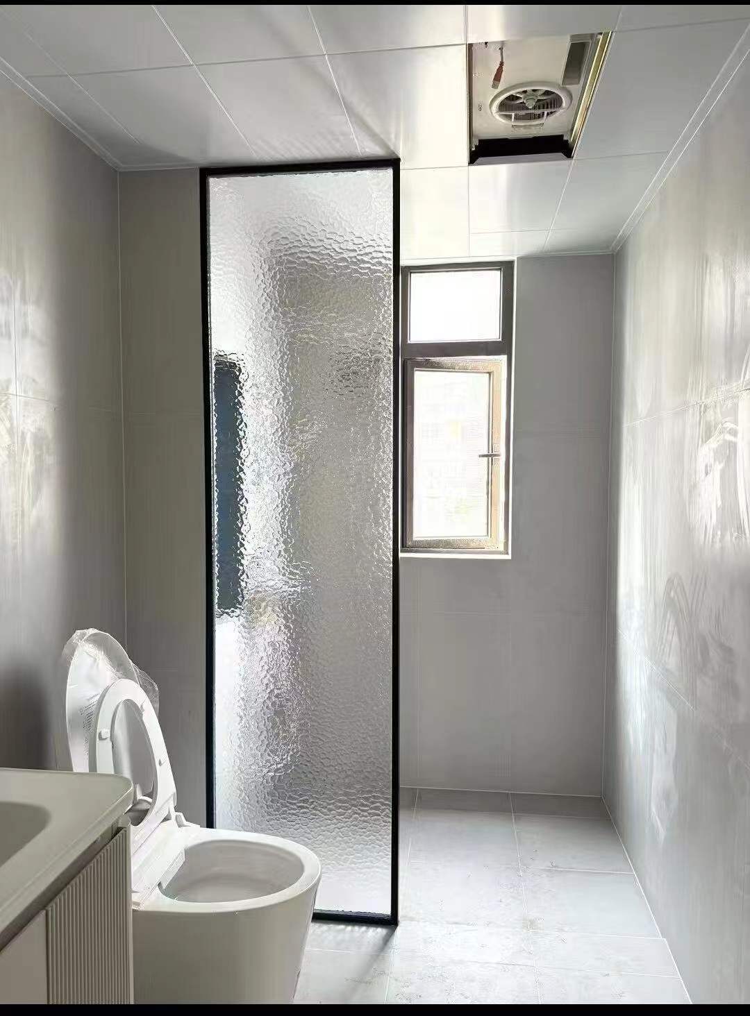 Small aluminum ventilation window in a bathroom