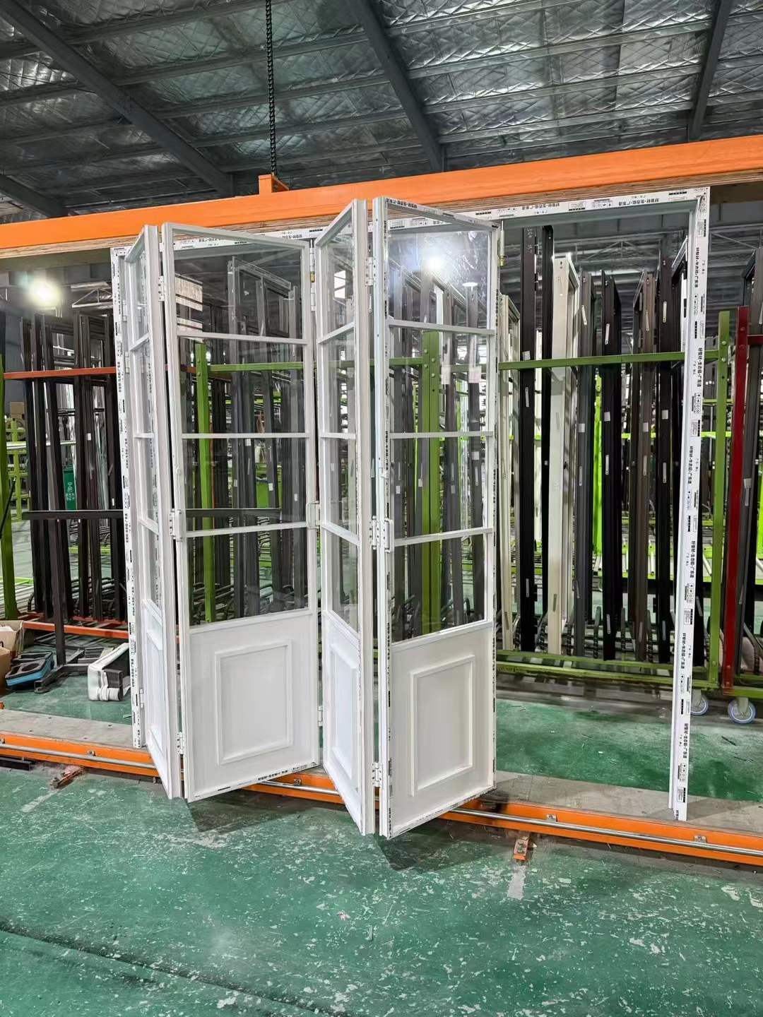 White multi-panel aluminum folding door system
