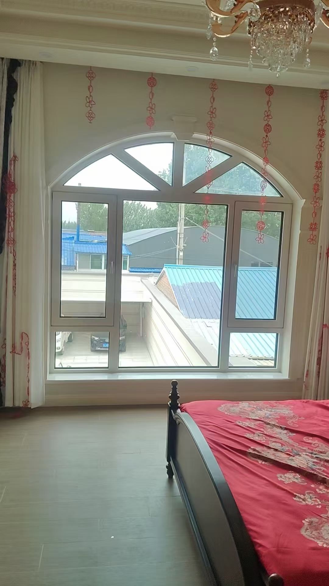Arched residential aluminum window installation