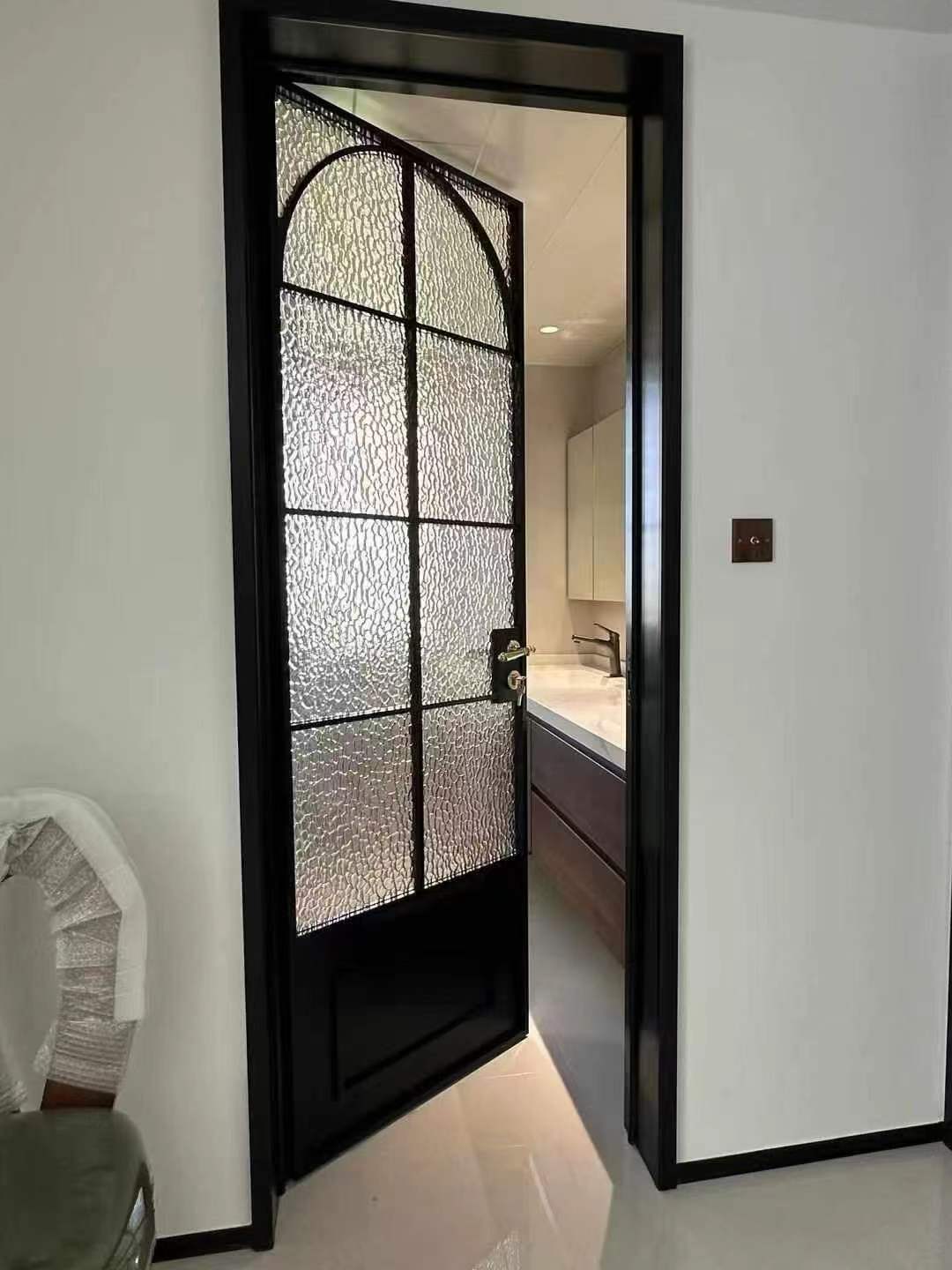 Tall black framed architectural glass door