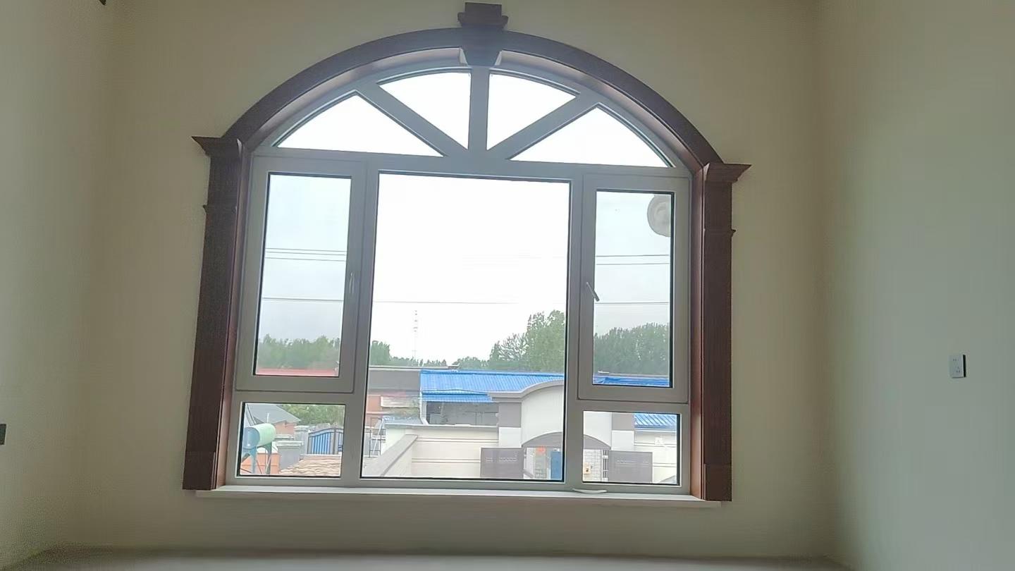 Custom arched aluminum window in a residential project